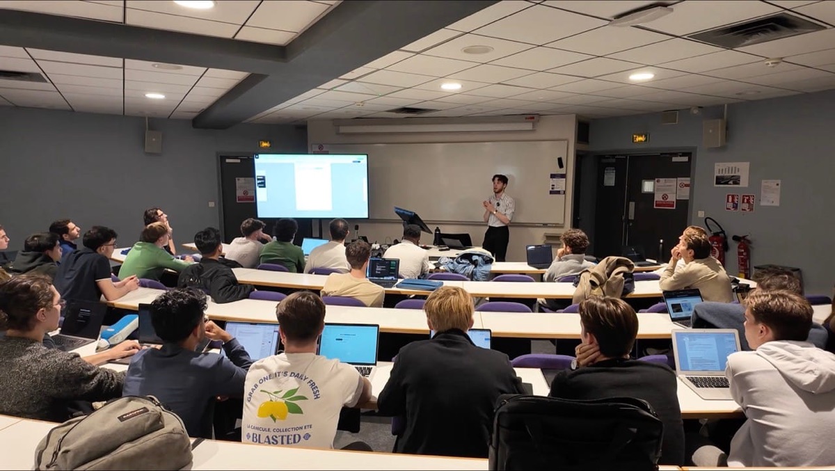 Students on laptops during a hands-on workshop
